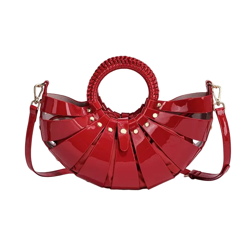 Red handbag with a unique design on a beige background