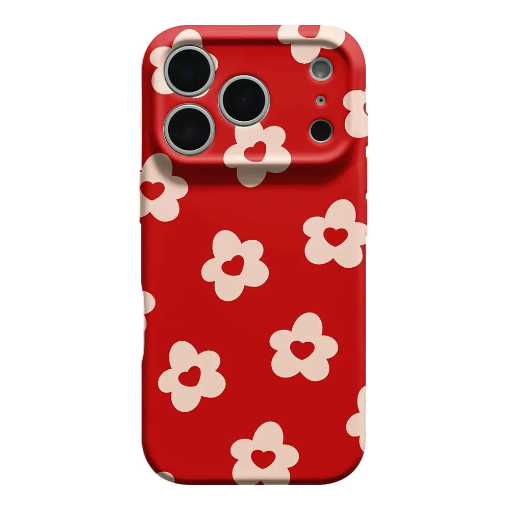 Phone case with red background and white floral pattern on a light gray background