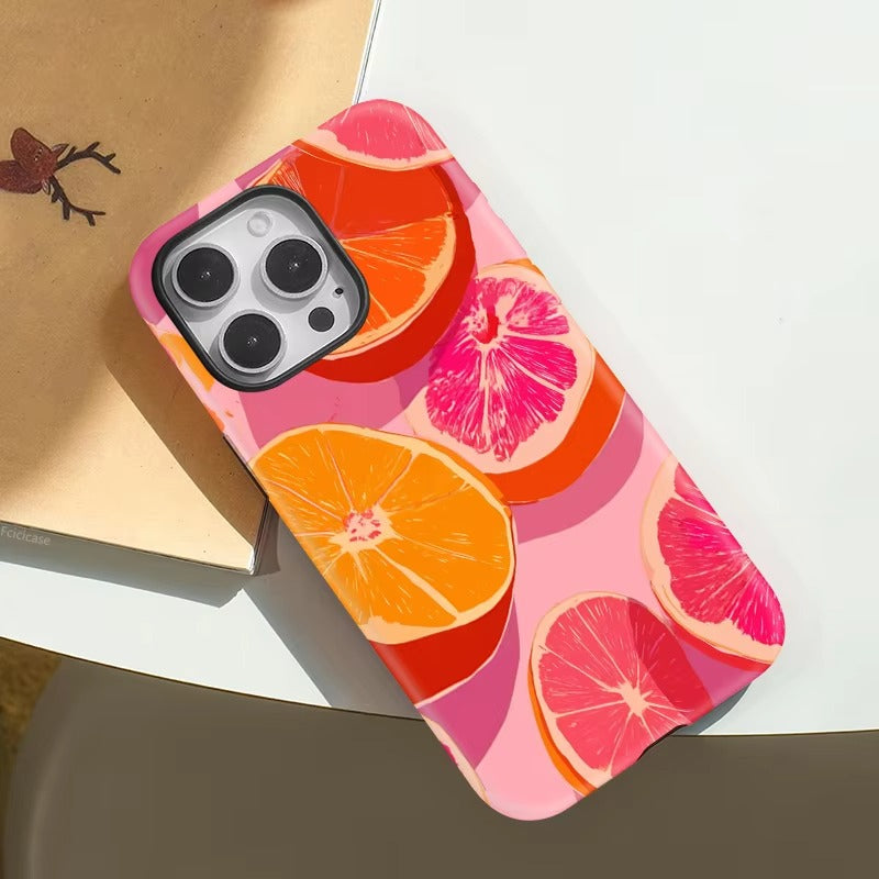 Phone case with citrus fruit design on a white surface