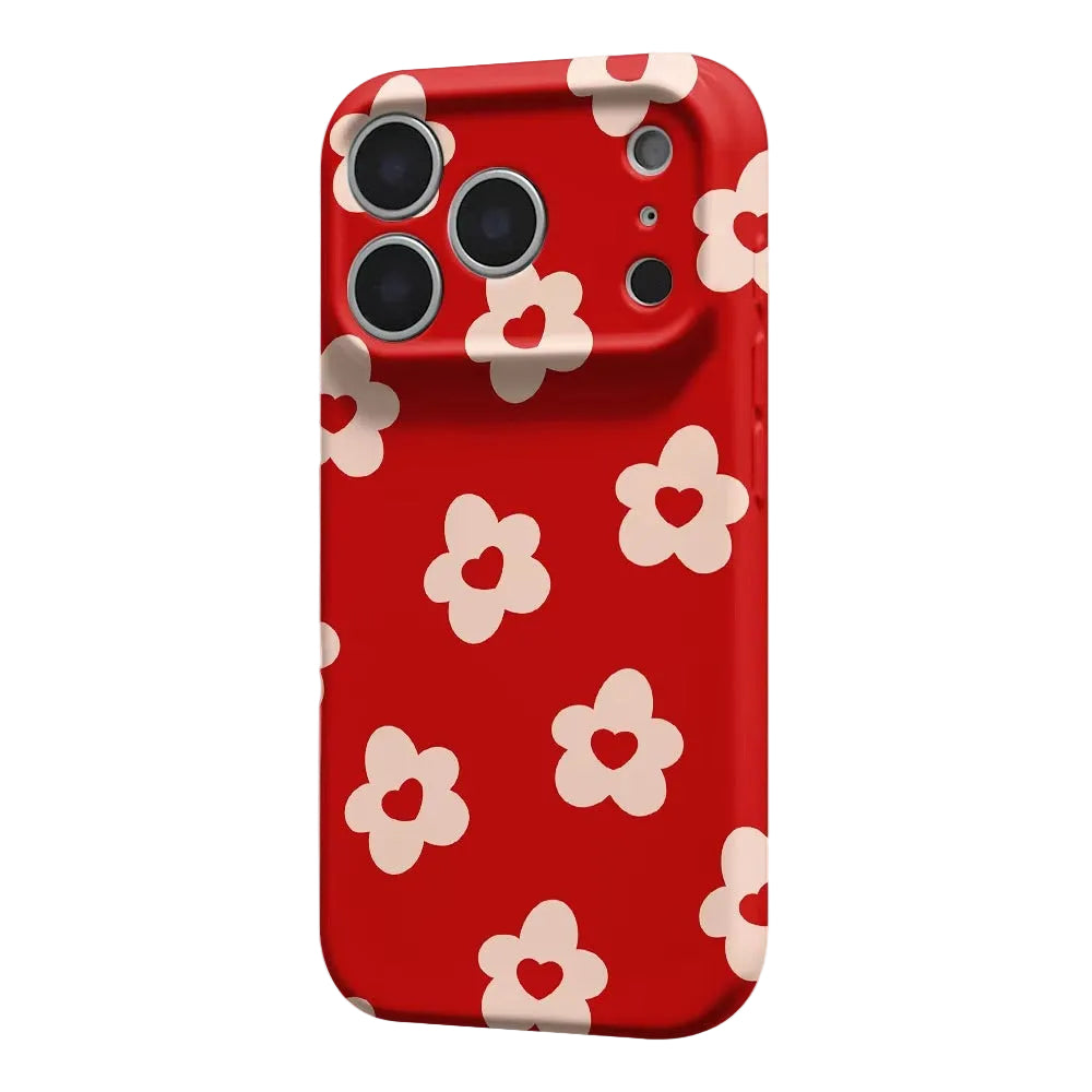 A red phone case with a repeating pattern of cream-colored flowers with heart-shaped centers, shown on a light gray background.