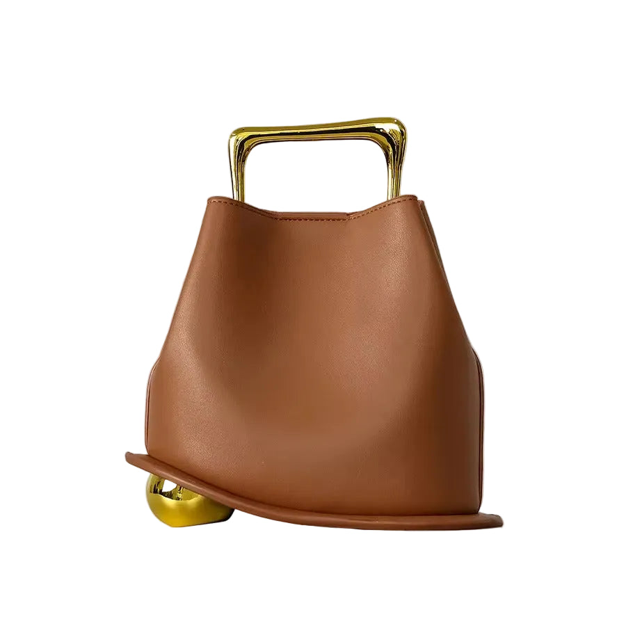 Brown handbag with gold accents on a light gray background