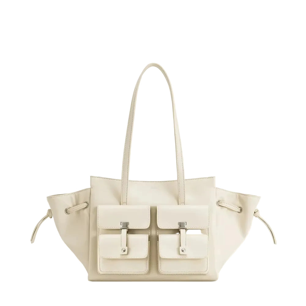 An off-white leather tote bag with dual shoulder straps and two front flap pockets, shown against a light cream background with the brand name 'JW PEI' printed above.