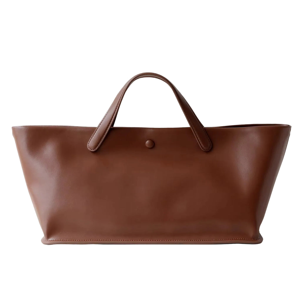 Brown leather tote bag on a white background